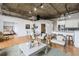 Open-concept living room with hardwood floors adjacent to the kitchen and dining areas at 3235 Roswell Ne Rd # 721, Atlanta, GA 30305