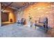 Modern lobby area features exposed brick wall, concrete ceiling, and modern seating at 3235 Roswell Ne Rd # 721, Atlanta, GA 30305