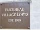 Bronze sign displaying the name of the establishment 