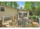 Inviting back deck with outdoor seating, perfect for relaxing or entertaining amidst the serene natural surroundings at 4553 Pond Ln, Marietta, GA 30062