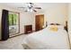 Cozy bedroom featuring a window, closet, and neutral decor at 4553 Pond Ln, Marietta, GA 30062