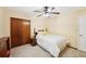 Charming bedroom showcasing neutral walls, carpet, closet, and natural light at 4553 Pond Ln, Marietta, GA 30062