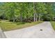 Long driveway leading to the house through a scenic and private, tree-filled yard at 4553 Pond Ln, Marietta, GA 30062