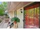 Charming front porch with a cozy seating area and lovely garden view at 4553 Pond Ln, Marietta, GA 30062