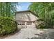 Spacious three-car garage with ample parking and mature landscaping at 4553 Pond Ln, Marietta, GA 30062