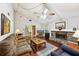 Open-concept living room with vaulted ceilings, stone fireplace, and hardwood flooring at 4553 Pond Ln, Marietta, GA 30062