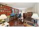 Cozy living room features hardwood floors, built-in bookshelves, and natural light from windows at 4553 Pond Ln, Marietta, GA 30062