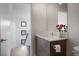 Compact powder room features wood grain vanity with white counter at 504 Rankin Ne St # 4, Atlanta, GA 30308