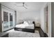 Bright bedroom with a large bed, ceiling fan, and sliding glass doors to an outdoor balcony at 504 Rankin Ne St # 4, Atlanta, GA 30308
