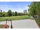 Expansive community green featuring walking paths, scooters, trees and city views in the distance at 504 Rankin Ne St # 4, Atlanta, GA 30308