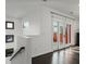 Hallway with French doors leading to a balcony and windows offering bright views at 504 Rankin Ne St # 4, Atlanta, GA 30308