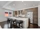 Modern kitchen boasts a large island with seating, stainless steel appliances, and beautiful wood grain cabinets at 504 Rankin Ne St # 4, Atlanta, GA 30308