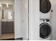 Convenient laundry closet with stacked washer and dryer located next to the powder room at 504 Rankin Ne St # 4, Atlanta, GA 30308