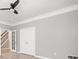 Bedroom with luxury vinyl floors, ceiling fan and staircase visible through an adjacent doorway at 5317 Concordia Se Pl # 10, Mableton, GA 30126