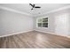 Bedroom with luxury vinyl floors, window, ceiling fan and an exterior door at 5317 Concordia Se Pl # 10, Mableton, GA 30126