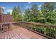 View of wooden deck overlooking lush greenery, creating a peaceful outdoor space at 5317 Concordia Se Pl # 10, Mableton, GA 30126
