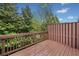 View of wooden deck with brown railing overlooking lush greenery, creating a relaxing outdoor space at 5317 Concordia Se Pl # 10, Mableton, GA 30126