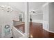 Elegant foyer with hardwood floors, chandelier lighting, and a staircase leading to an open living space at 5317 Concordia Se Pl # 10, Mableton, GA 30126