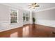 Bright living room with large windows, hardwood floors, white molding and a ceiling fan at 5317 Concordia Se Pl # 10, Mableton, GA 30126