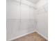 Walk-in closet with built-in shelving and neutral carpet at 5317 Concordia Se Pl # 10, Mableton, GA 30126