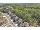 An aerial view of the neighborhood with lush, green trees and manicured lawns at 5382 Pebblebrook Se Ln, Mableton, GA 30126