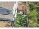 Aerial view of the backyard with artificial grass and a wooden deck at 5382 Pebblebrook Se Ln, Mableton, GA 30126
