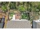 Aerial view of the backyard with a deck, grill, and putting green at 5382 Pebblebrook Se Ln, Mableton, GA 30126