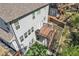 Aerial view of the back exterior featuring a grill on the deck and artificial grass at 5382 Pebblebrook Se Ln, Mableton, GA 30126