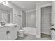 Bathroom features a vanity, toilet, and combination tiled shower and tub at 5382 Pebblebrook Se Ln, Mableton, GA 30126