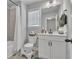 Bathroom features a toilet, white vanity with storage, and a tiled shower/tub combination at 5382 Pebblebrook Se Ln, Mableton, GA 30126