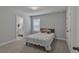 Bedroom featuring carpet flooring, a window, and a door leading into a bathroom at 5382 Pebblebrook Se Ln, Mableton, GA 30126