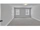 Bright bedroom with two windows allowing natural light and neutral color palette at 5382 Pebblebrook Se Ln, Mableton, GA 30126