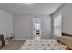 Bedroom featuring carpet flooring and a door leading into another bedroom at 5382 Pebblebrook Se Ln, Mableton, GA 30126