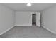 Bedroom with gray carpet, freshly painted gray walls, and a closet at 5382 Pebblebrook Se Ln, Mableton, GA 30126