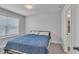 Neutral bedroom with grey walls, carpet flooring, and a queen sized bed at 5382 Pebblebrook Se Ln, Mableton, GA 30126