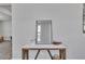 Decorated entryway featuring a mirror and marble topped table, adding a touch of elegance at 5382 Pebblebrook Se Ln, Mableton, GA 30126