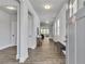 Bright entryway with wood floors, white walls, and natural light streaming through the windows at 5382 Pebblebrook Se Ln, Mableton, GA 30126