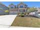 Charming two-story home featuring a stone facade, two-car garage, and a beautifully landscaped front yard at 5382 Pebblebrook Se Ln, Mableton, GA 30126