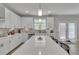 Modern kitchen features white cabinets, a center island, and stainless steel appliances at 5382 Pebblebrook Se Ln, Mableton, GA 30126
