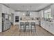 Modern kitchen with stainless steel appliances, white cabinets, and a center island with seating at 5382 Pebblebrook Se Ln, Mableton, GA 30126