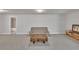 Spacious, carpeted living room with a comfortable couch, coffee table, and ample lighting at 5382 Pebblebrook Se Ln, Mableton, GA 30126