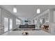 Bright, open living space with hardwood floors, a fireplace, and built-in shelving at 5382 Pebblebrook Se Ln, Mableton, GA 30126