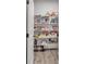 Well-stocked pantry with wire shelving and laminate floors, for optimal storage at 5382 Pebblebrook Se Ln, Mableton, GA 30126
