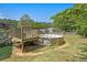 Backyard featuring a small deck and above-ground pool at 126 Amberwood Ln, Euharlee, GA 30145