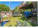 Backyard with a trampoline, shed, and mature trees at 126 Amberwood Ln, Euharlee, GA 30145