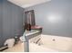 Bathtub with tile surround and decorative accessories at 126 Amberwood Ln, Euharlee, GA 30145