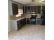 Functional kitchen featuring tile flooring and modern appliances at 126 Amberwood Ln, Euharlee, GA 30145
