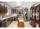 Kitchen featuring brown cabinets, a stainless steel refrigerator, and a cooking island at 126 Amberwood Ln, Euharlee, GA 30145