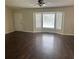 Open living room featuring hardwood floors and a bright bay window at 126 Amberwood Ln, Euharlee, GA 30145