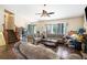 Cozy living room with sofas, wood flooring, and a ceiling fan at 126 Amberwood Ln, Euharlee, GA 30145